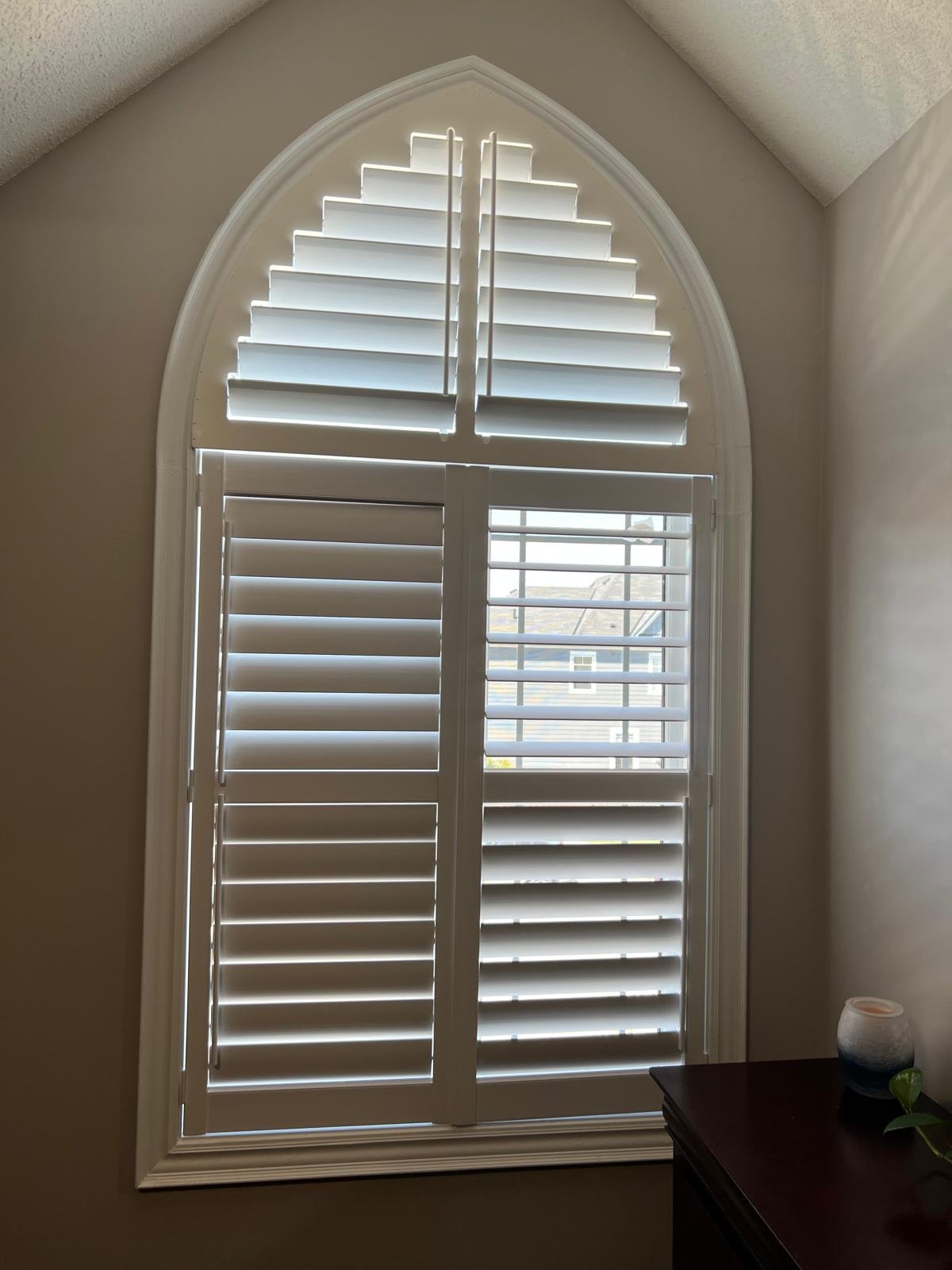 GTA arched window plantation shutters with custom frame