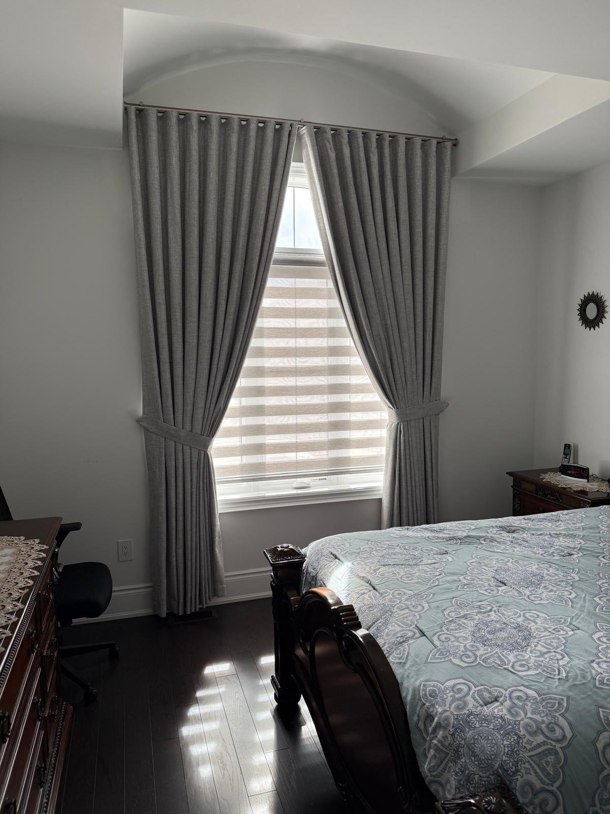 GTA bedroom curved drapery around a window