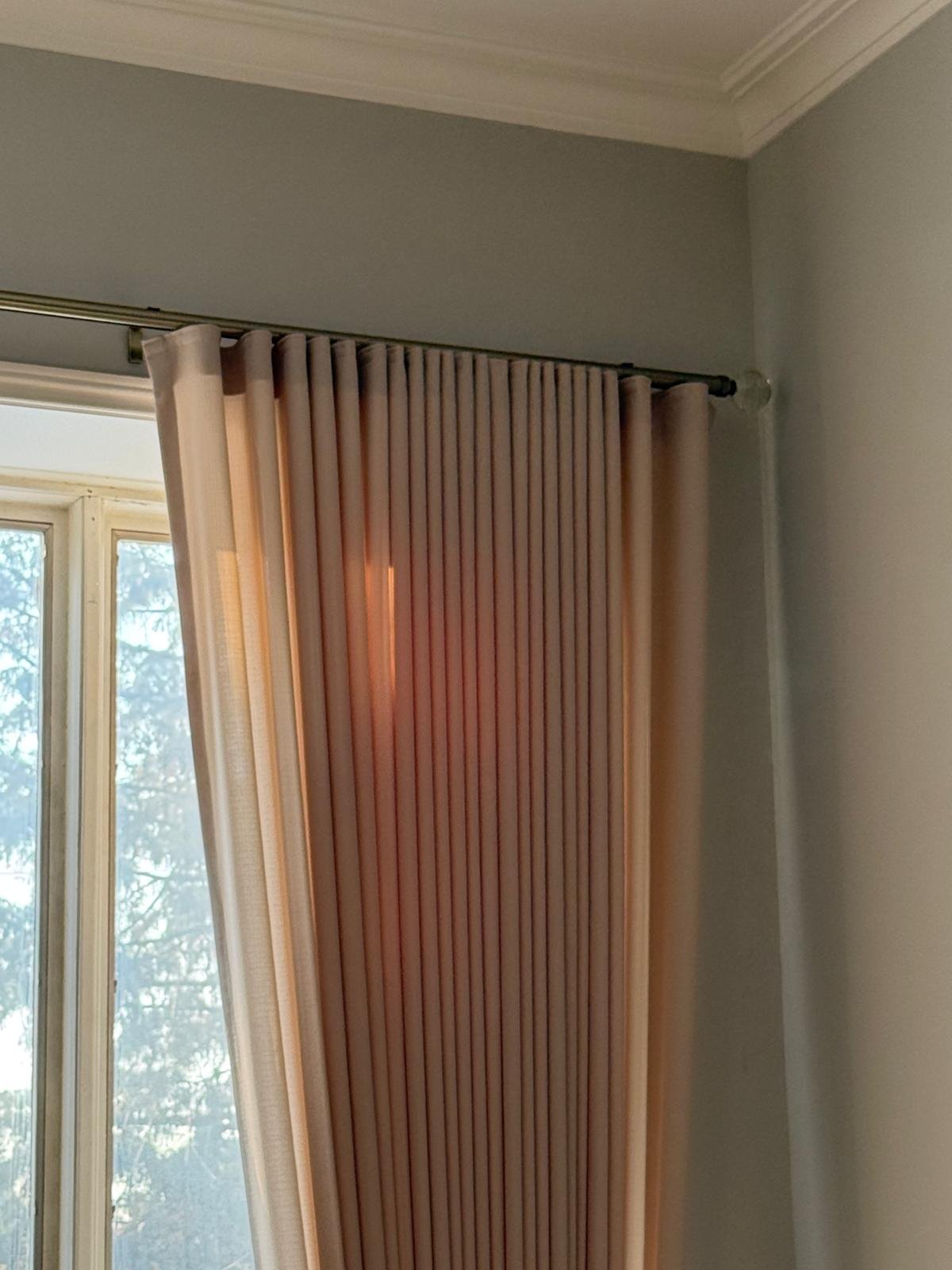 GTA bedroom vertical drapery panels beside a window