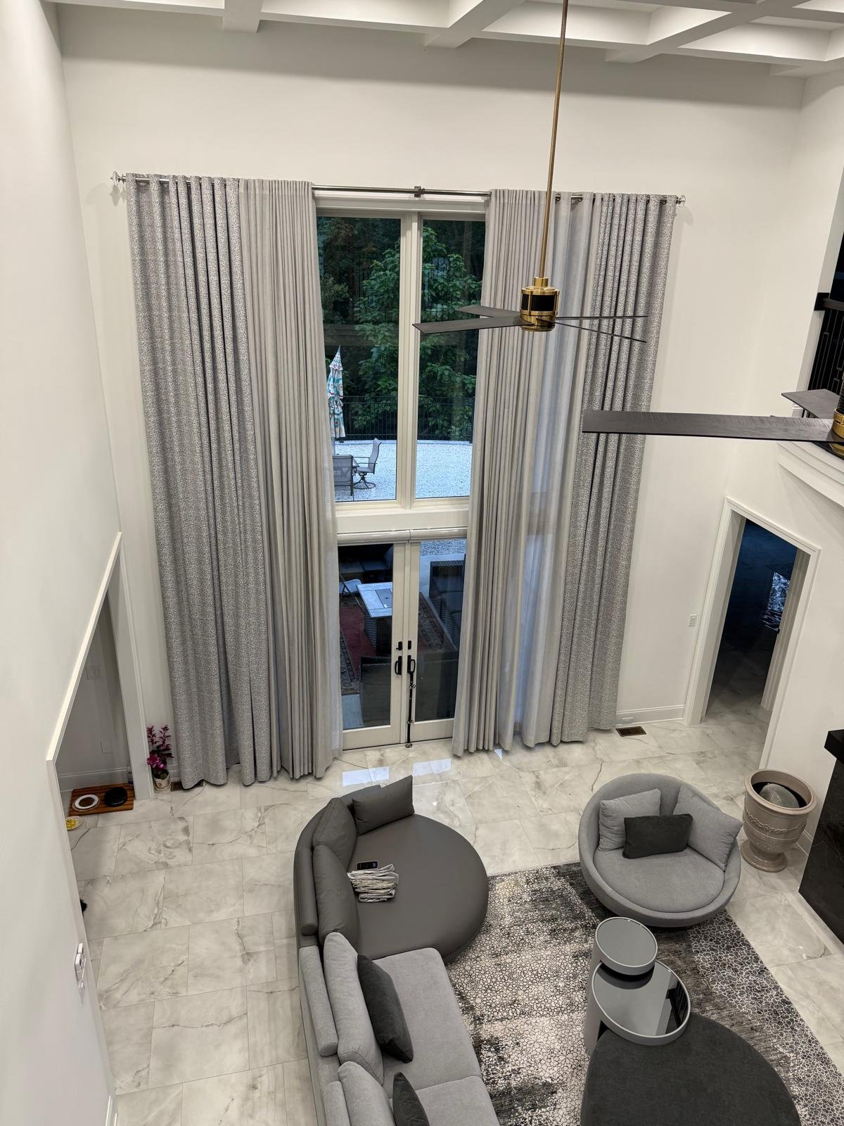GTA living room grey drapery panels with custom window treatment