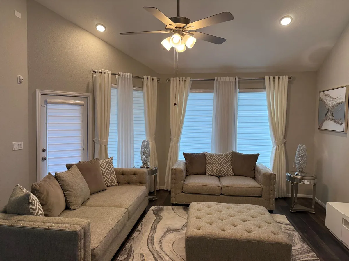 layered drapery and zebra shades installed in a Mississauga living room