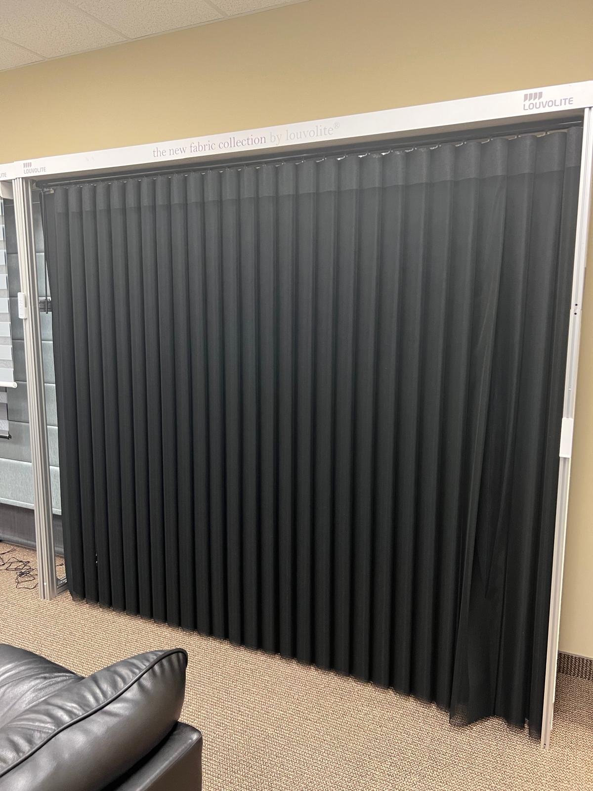 Toronto wall-to-wall blackout drapery installation for a media or bedroom space