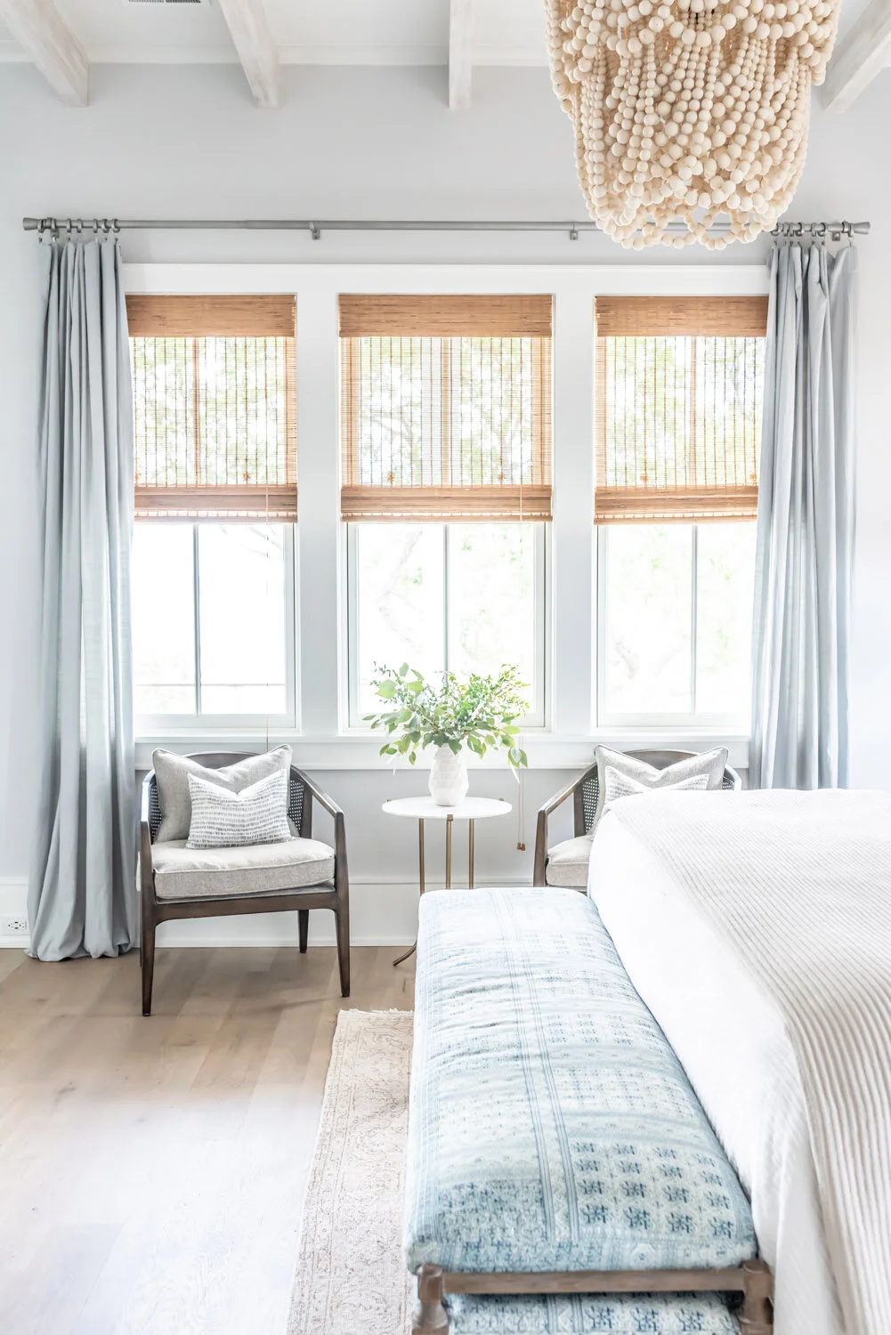 Drapery layered with shades for privacy and softness